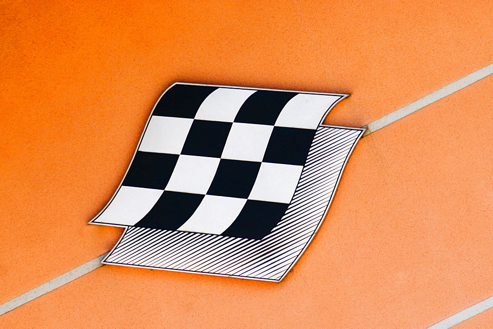 Checkered flag on an information board, Le Mans, France