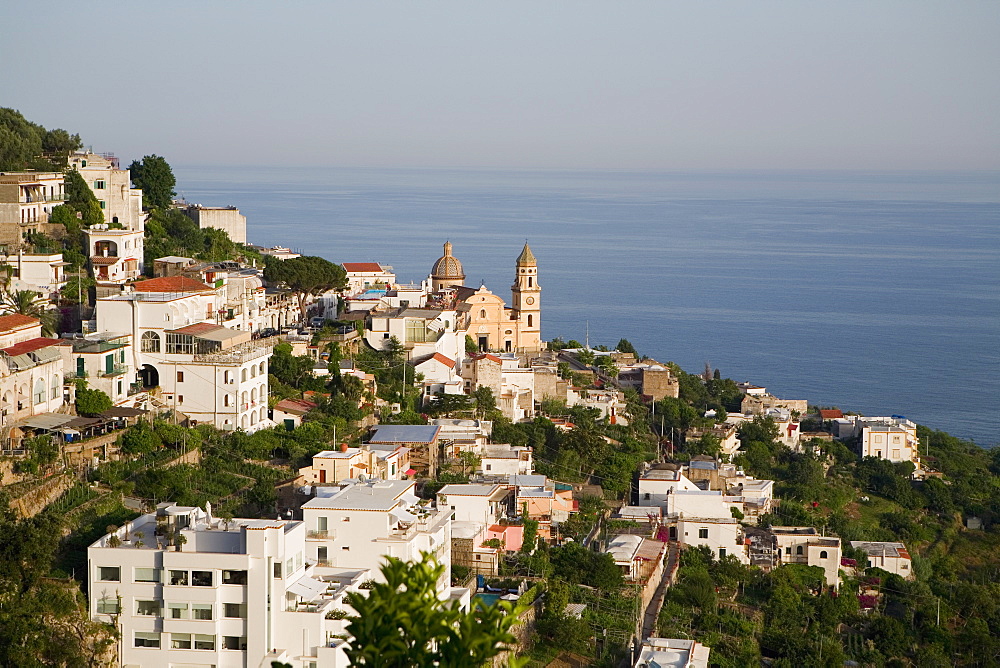 High angle view of buildings in a town with a church in the background, Parrocchiale di San Gennaro, Amalfi Coast, Maiori, Salerno, Campania, Italy