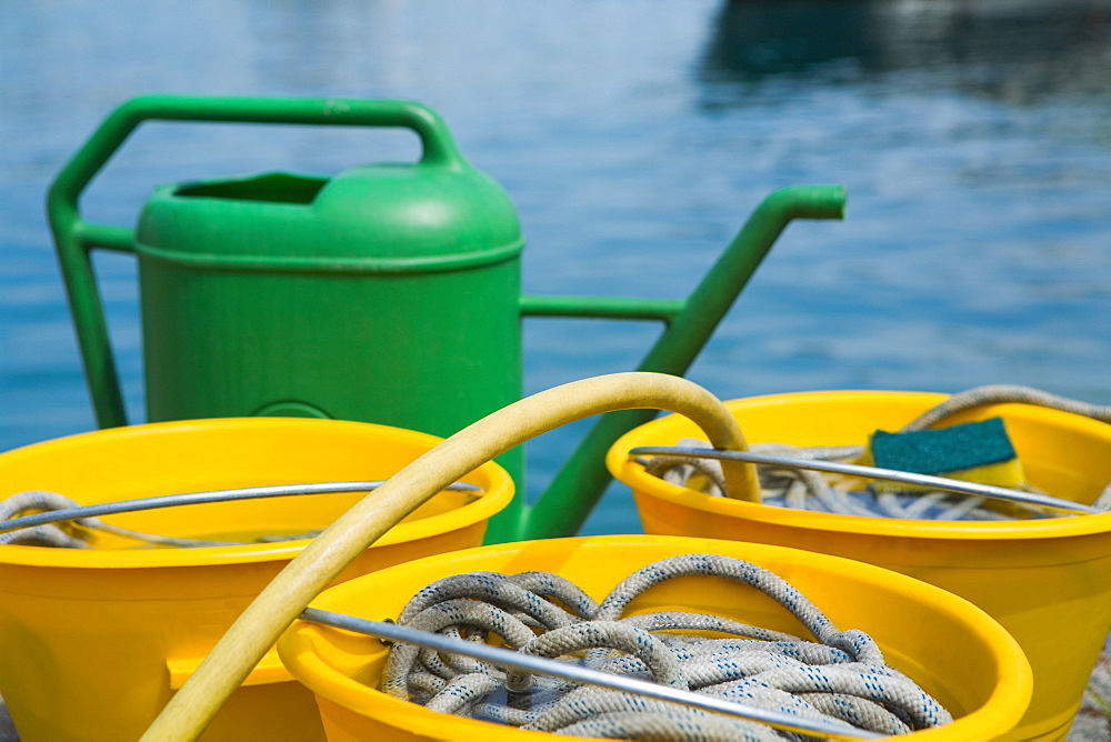 Close-up of buckets with a watering can, Italian Riviera, Santa Margherita Ligure, Genoa, Liguria, Italy