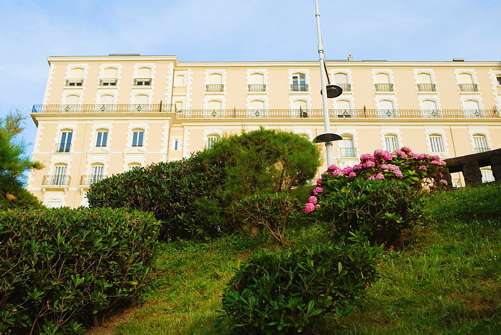 Low angle view of a formal garden in front of a building, Biarritz, Basque Country, Pyrenees-Atlantiques, Aquitaine, France