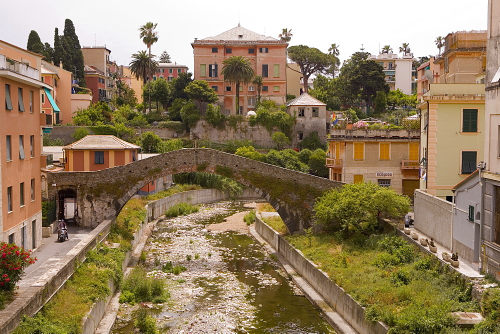 Arch bridge near buildings, Genoa Province, Liguria, Italy