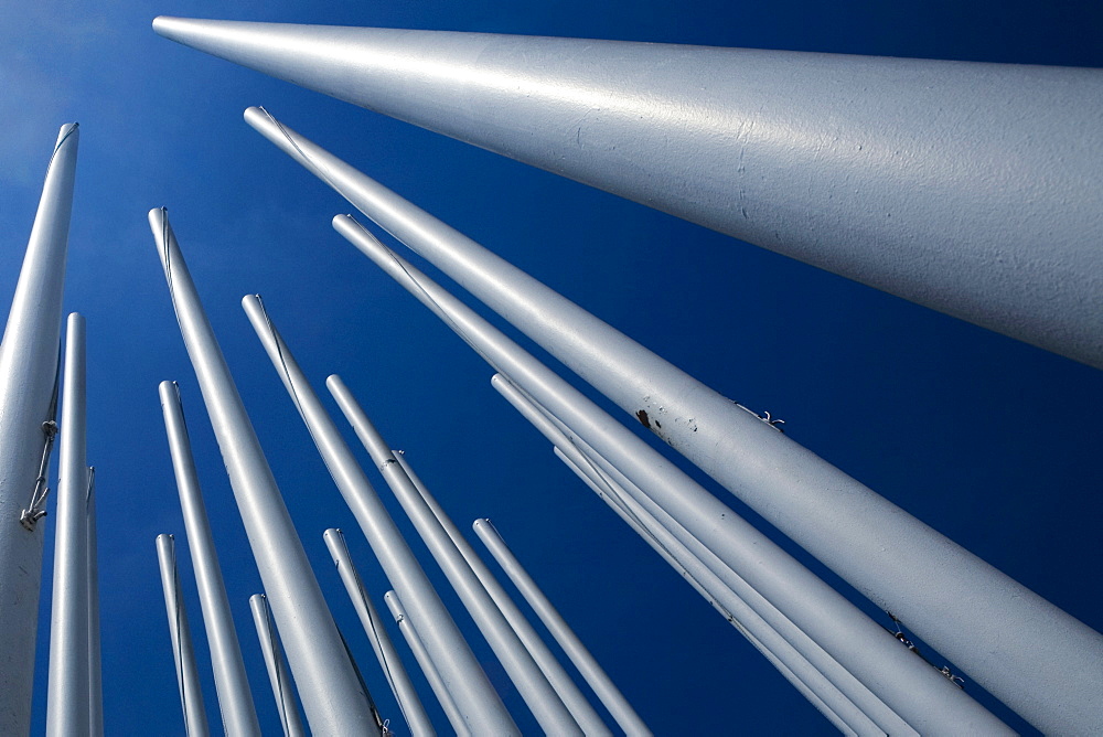 Low angle view of flag poles, Bordeaux, Aquitaine, France