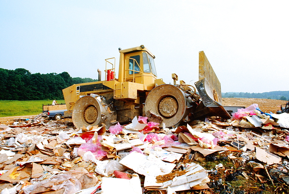 Bulldozer at garbage dump, Howard, Maryland, USA