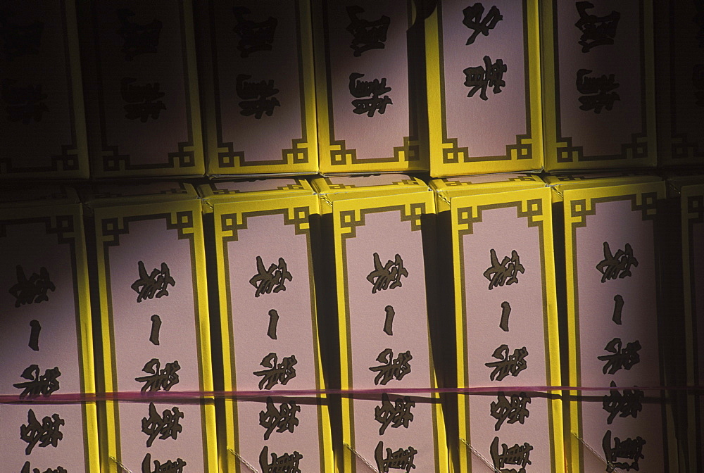 Close-up of Chinese script written on boxes