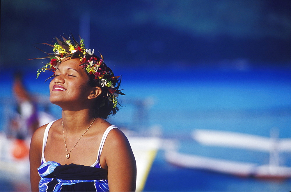 Close-up of a young woman wearing a laurel wreath, Hawaii, USA