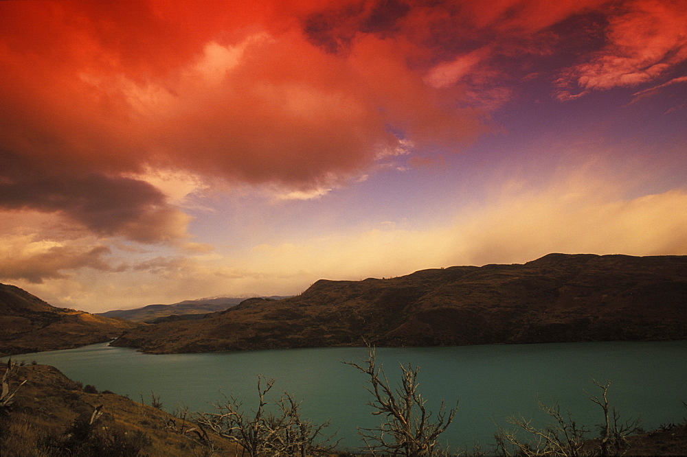 Rainy clouds over mountains at dusk