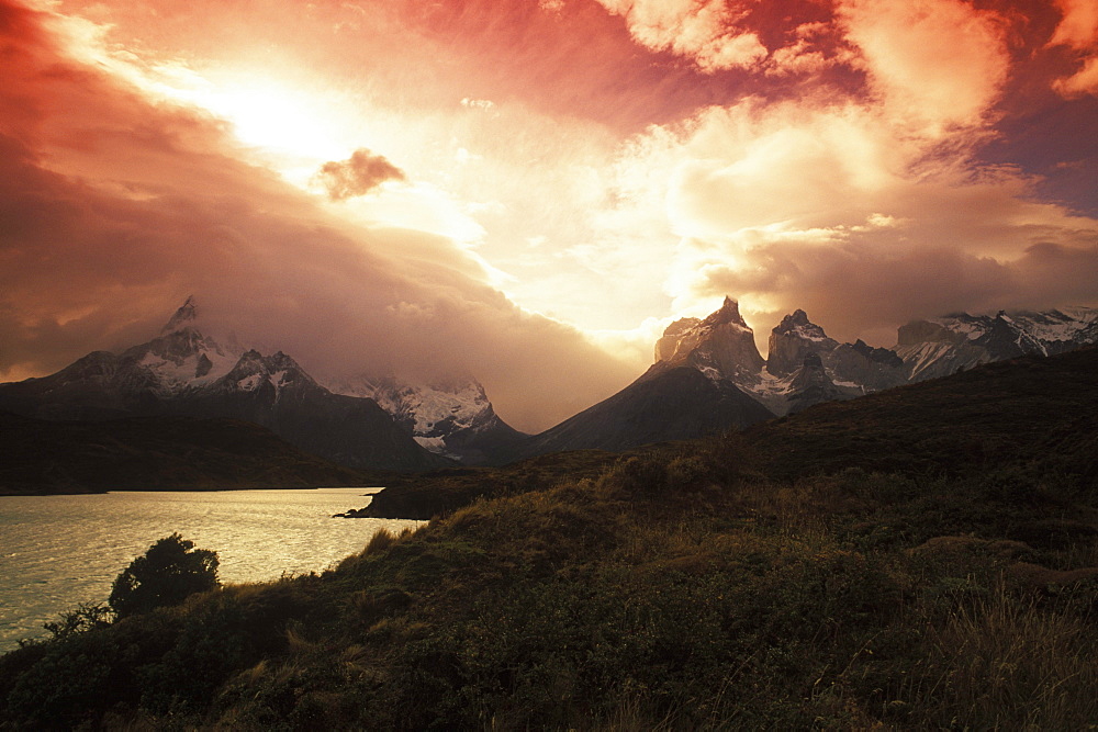 Rainy clouds over mountains at dusk