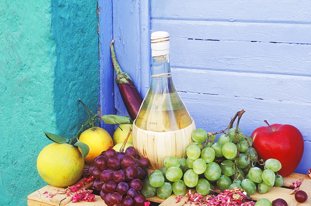 Close-up of a bottle with fruit on the table