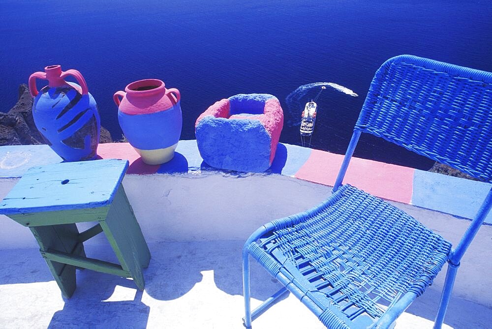 High angle view of a chair with decorative urns