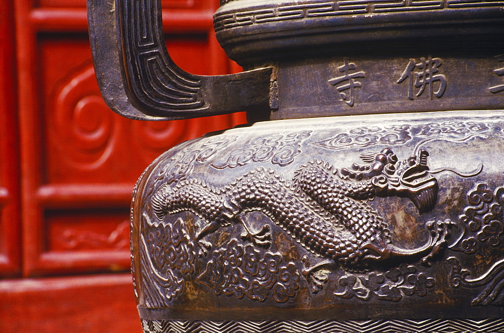 Close-up of a dragon on a decorative urn, China