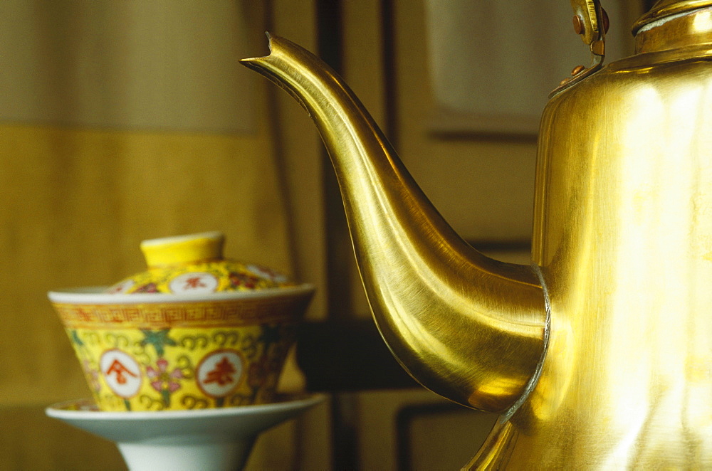 Close-up of a golden teapot