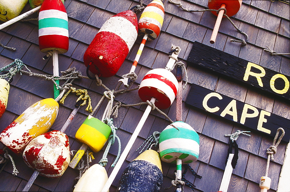 Group of fishing bobbers hanging on a wall