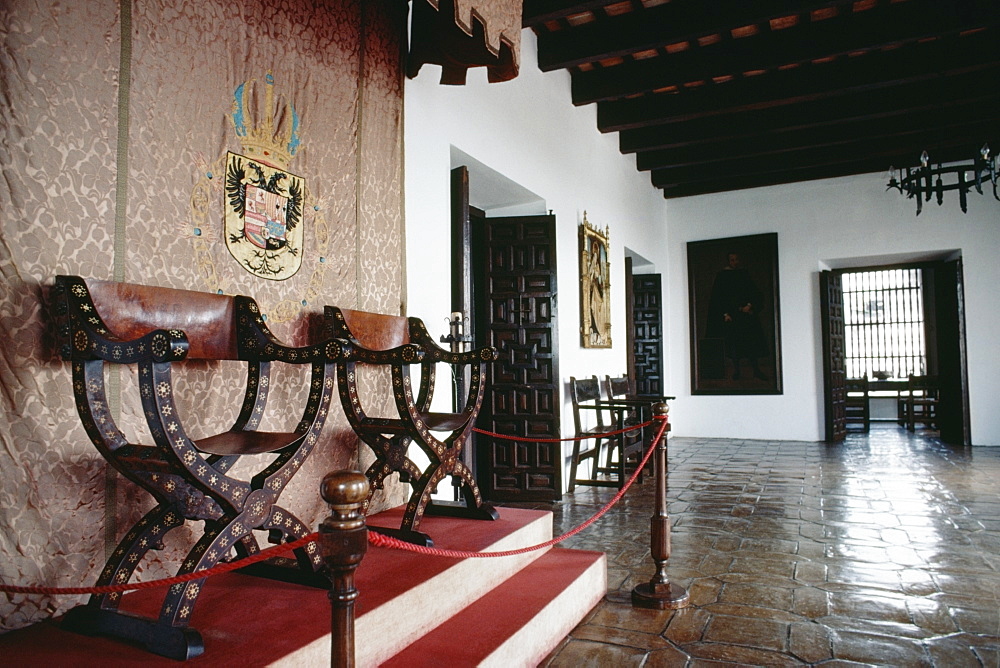 Side view of two antique chairs enclosed in a fence, Old San Juan, Puerto Rico