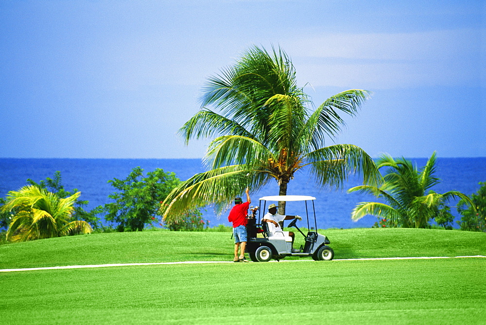 A golf cart is seen on a golfcourse at Wyndham Resort, Jamaica