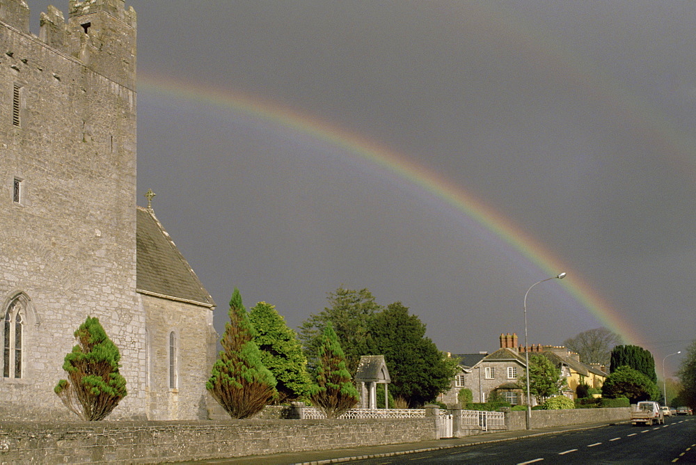 Rainbow over buildings, Adare, Republic of Ireland