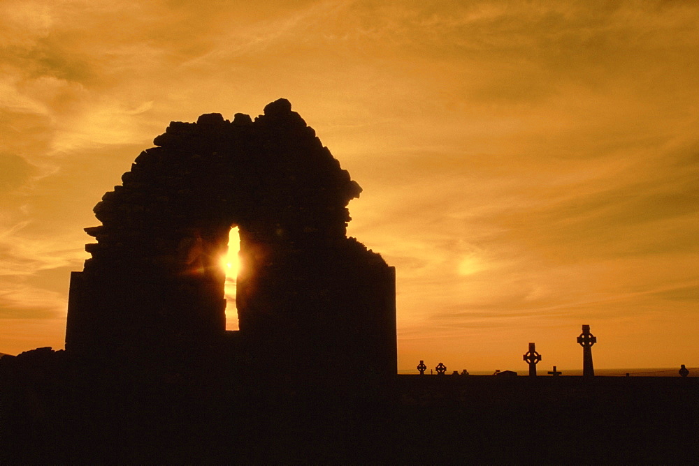 Celtic crosses at sunset in a cemetery, County Clare, Republic of Ireland