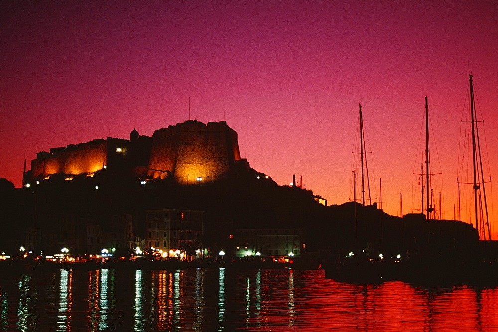 Scenic view of a fortress and a harbor at night, Bonifacio, Corsica, France