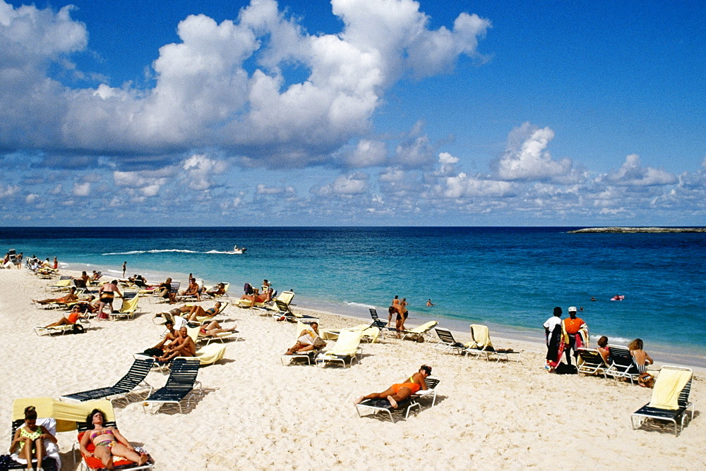 Large group of tourists sunbathing on a beach, Paradise Island, Bahamas