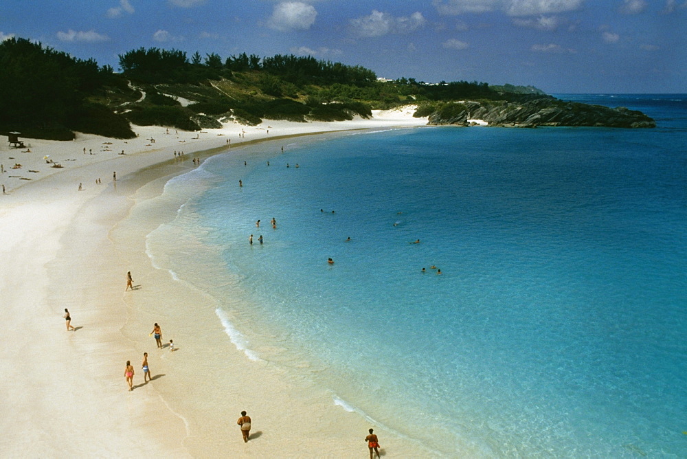 Large group of people holidaying on Horseshoe bay beach, Bermuda