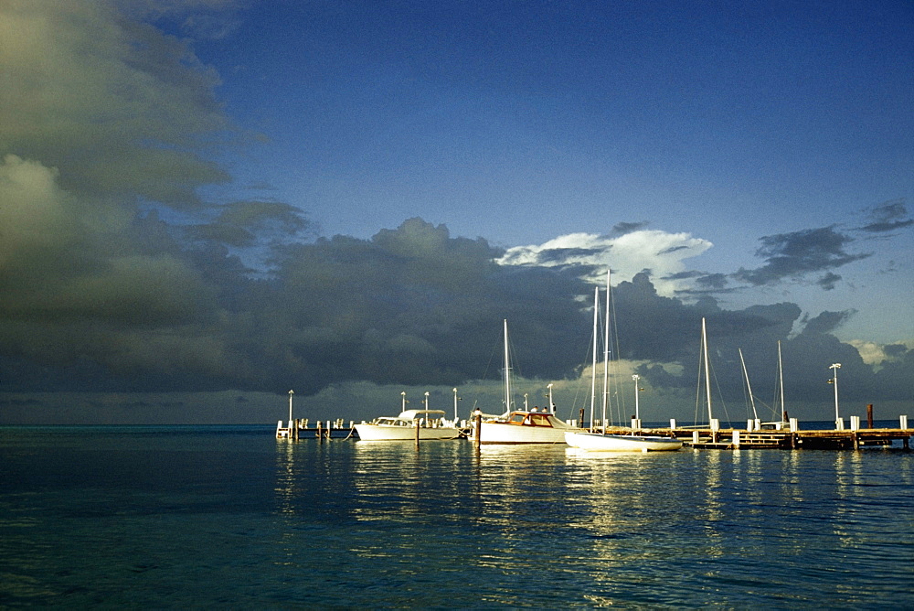 Scenic view of boats anchored to a marina at sunset, Grand Bahamas, Bahamas