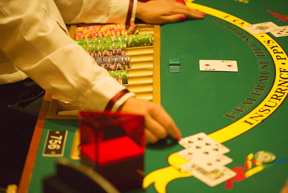 High angle view of a casino worker playing blackjack, Las Vegas, Nevada, USA