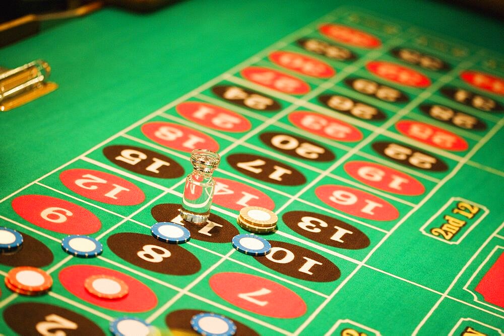 High angle view of a win marker and gambling chips on a roulette table, Las Vegas, Nevada, USA