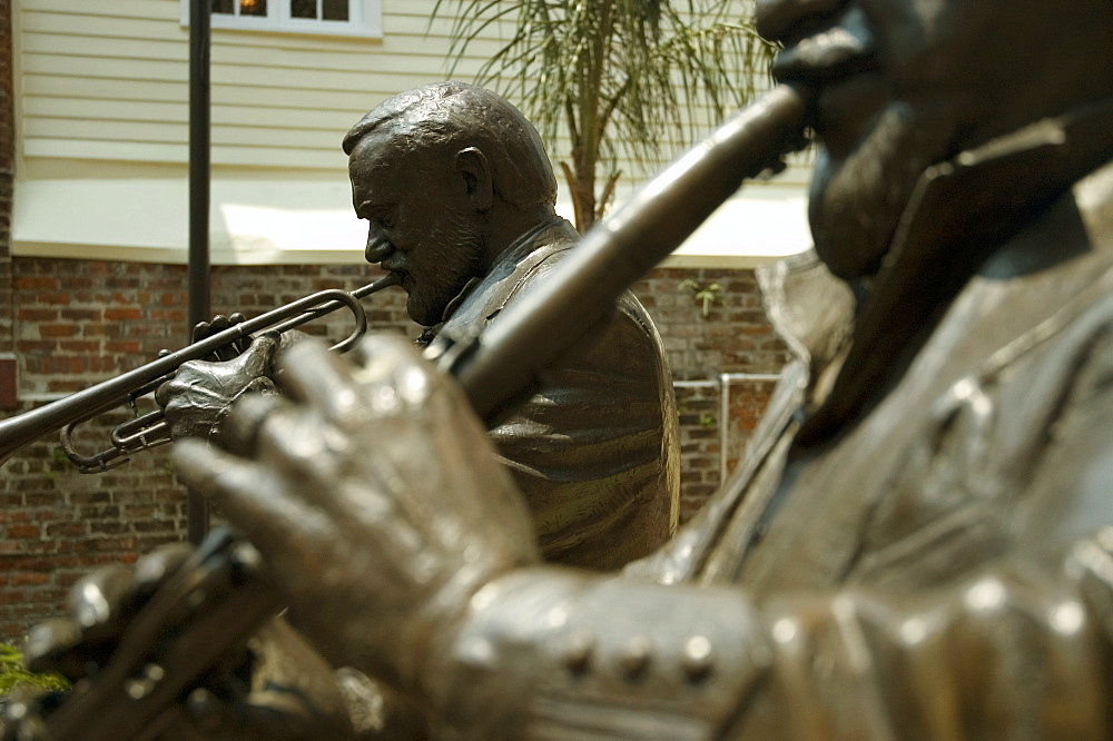 Close-up of statues of two musicians playing musical instruments, New Orleans, Louisiana, USA