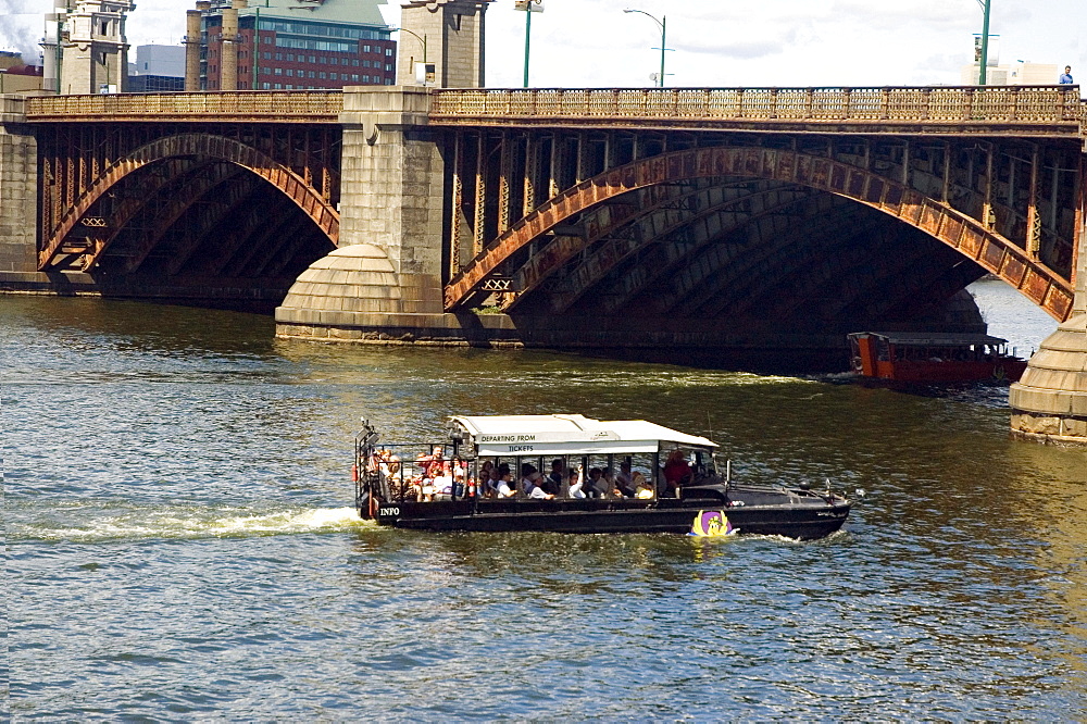 Tourist in a streamer near an arch bridge, Boston, Massachusetts, USA