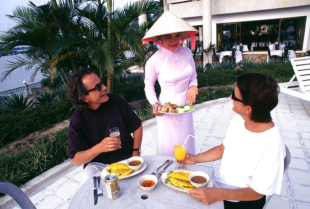 Three people dining at Century Riverside Hotel, Hue, Vietnam