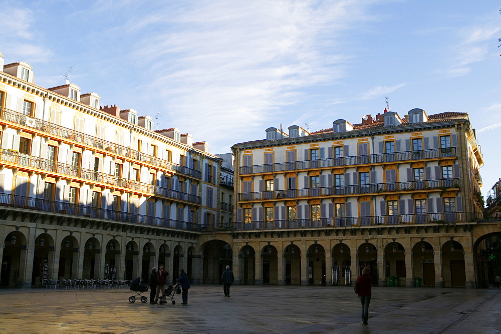 Group of people standing in a courtyard, Spain