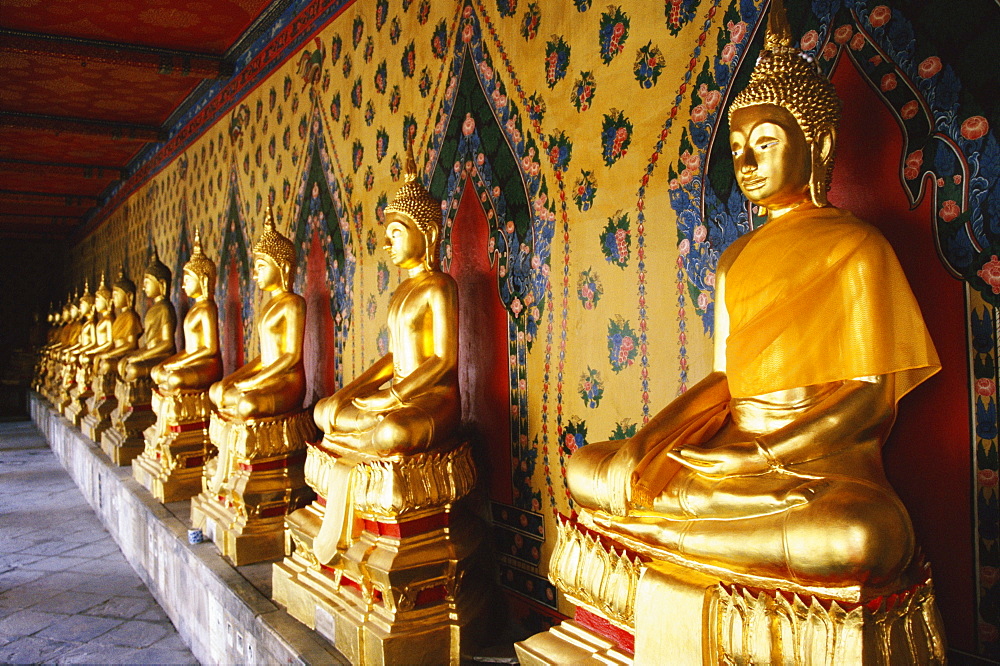 Row of statues of Buddha in a temple, Wat Arun, Bangkok, Thailand