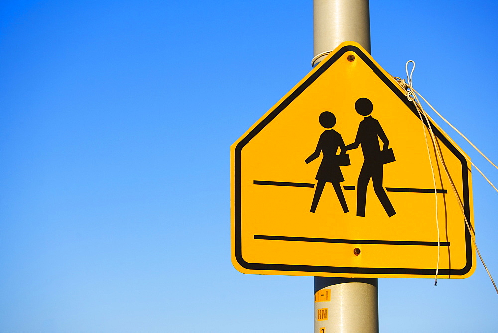 Close-up of a school crossing sign