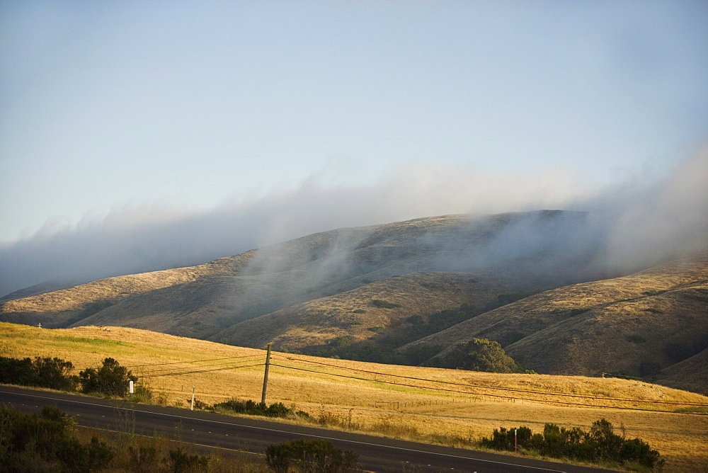 Clouds rolling over a hill range