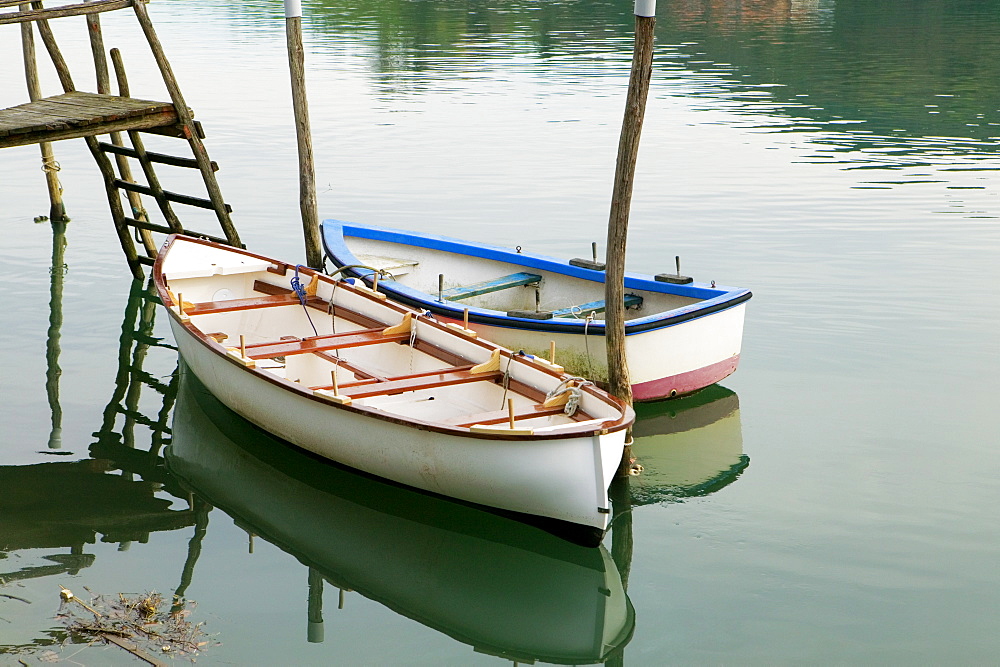 High angle view of two boats moored near a wooden pier, Spain