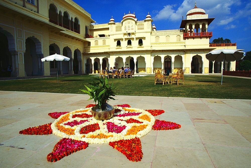 Tourists in courtyard of a hotel, Rambagh Palace Hotel, Jaipur, Rajasthan, India