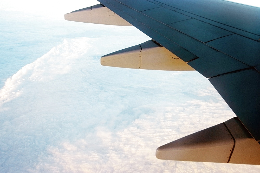 Close-up of an airplane wing in flight