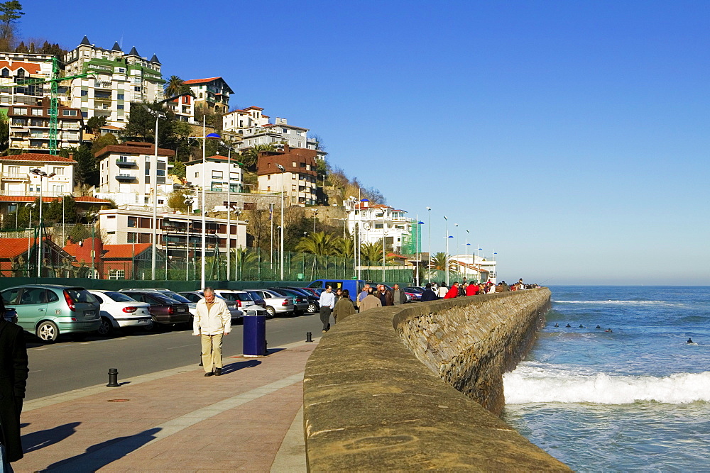 Group of people walking on a pier, Spain