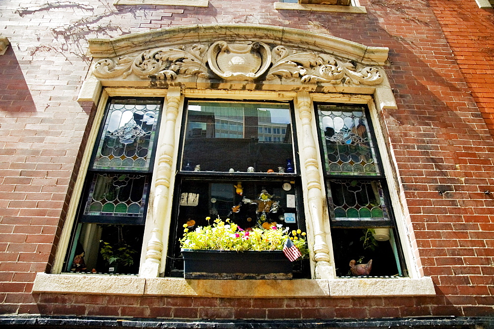 American flag with plants in a window box, Boston, Massachusetts, USA