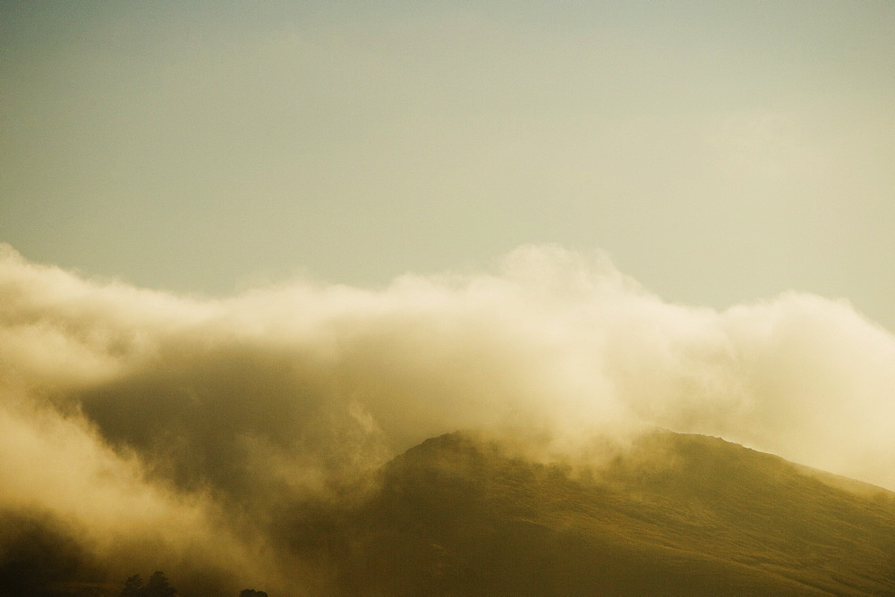 Clouds rolling over a hill range