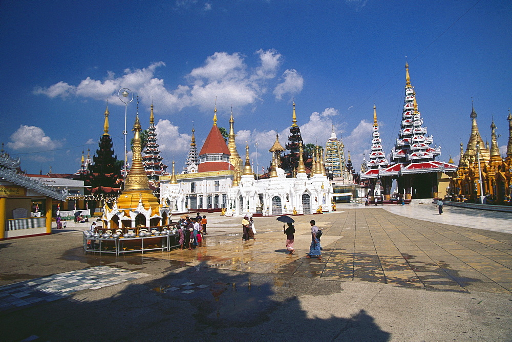 Pilgrims in front of a pagoda, Shwedagon Pagoda, Yangon, Myanmar