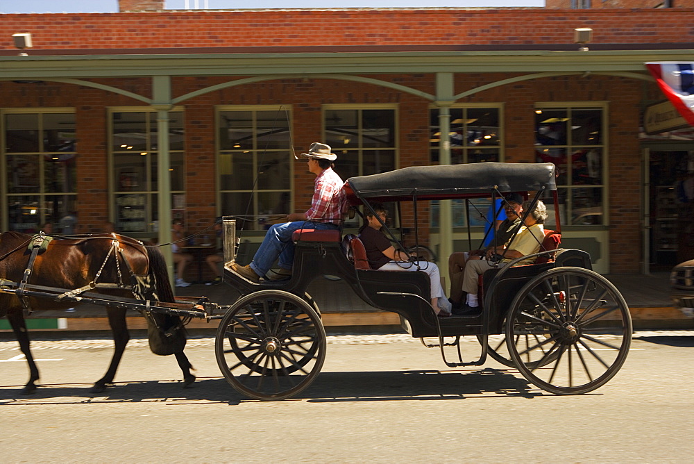 Side profile of a carriage in front of a store