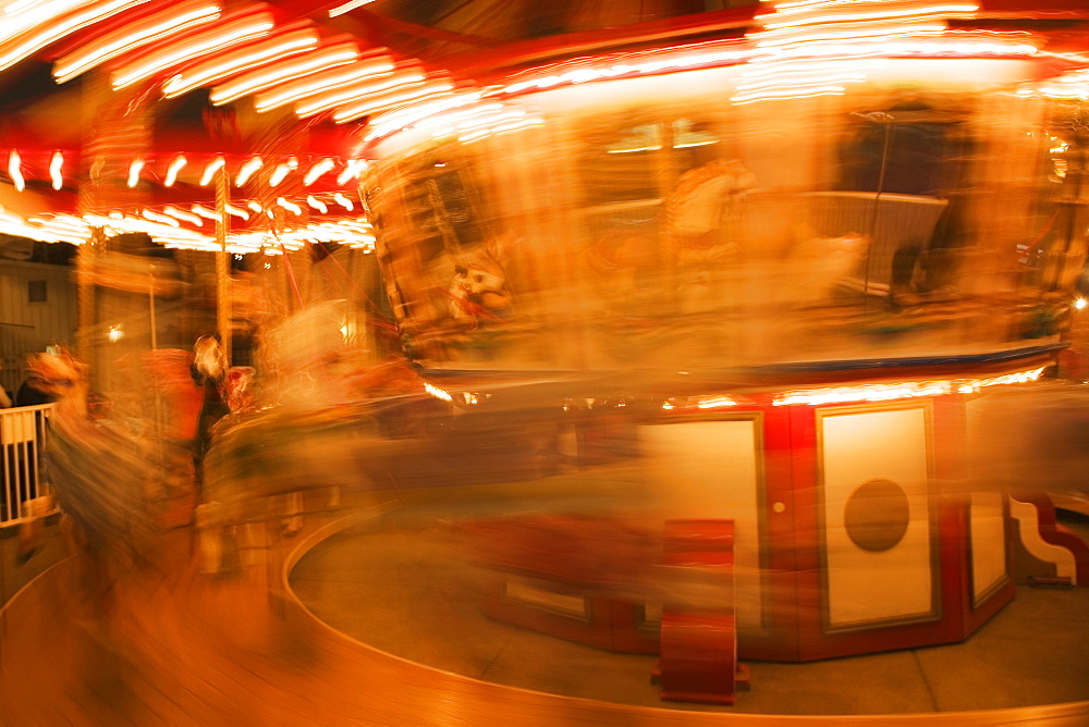 Close-up of a carousel at night