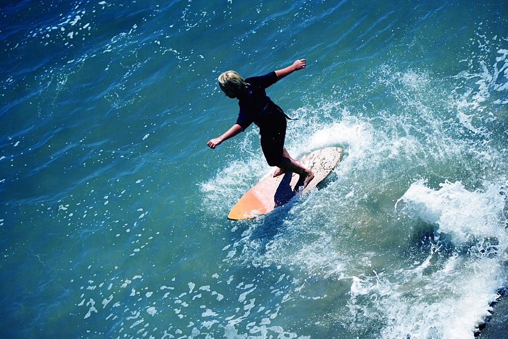 High angle view of a boogie boarder on the beach