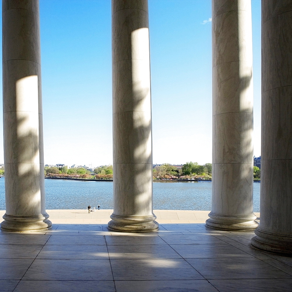 Columns at Jefferson Memorial with Tidal Basin in the background, Washington DC, USA