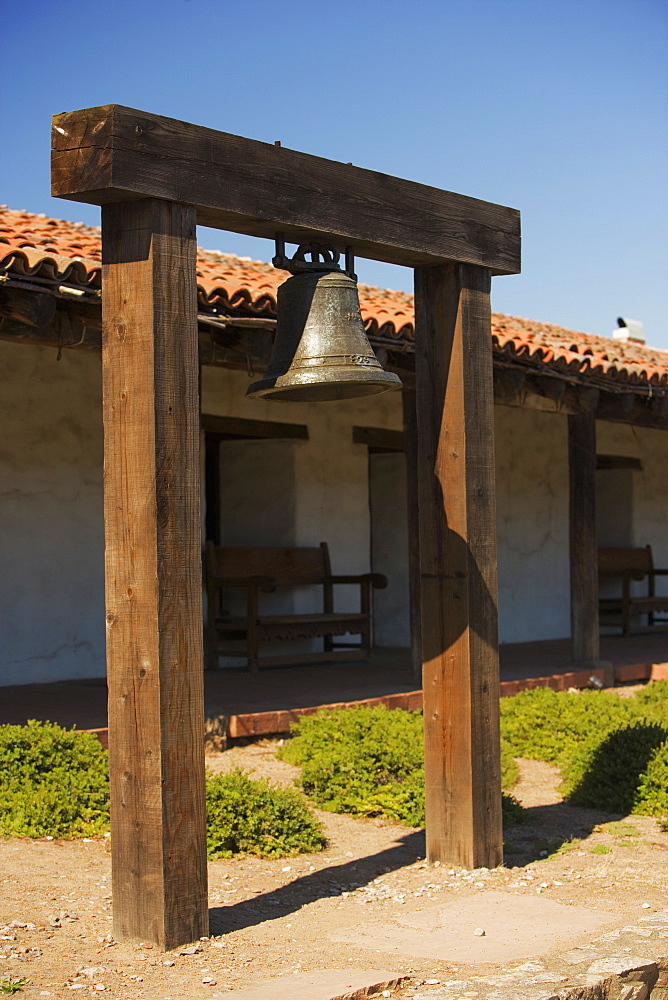 Bell hanging in front of a house