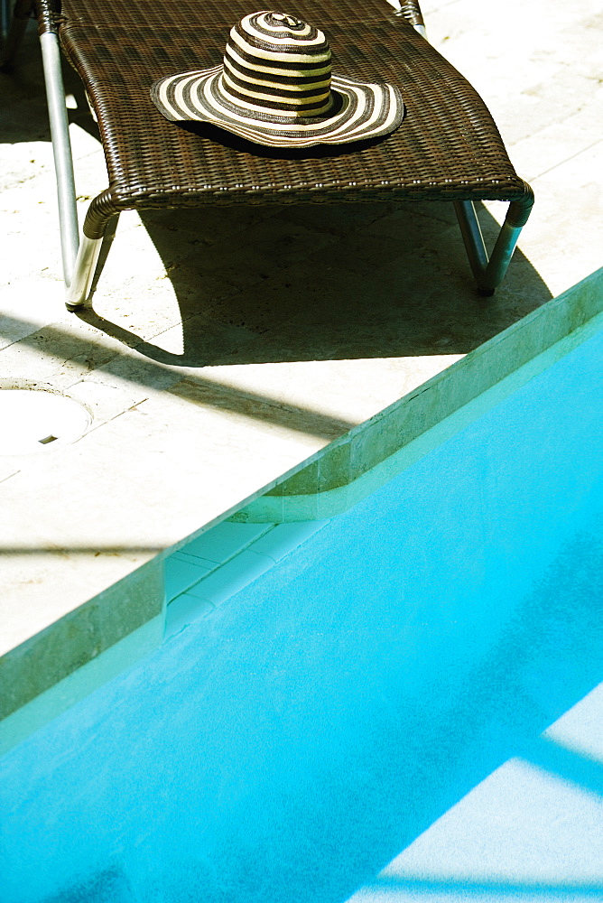 High angle view of a lounge chair at the poolside