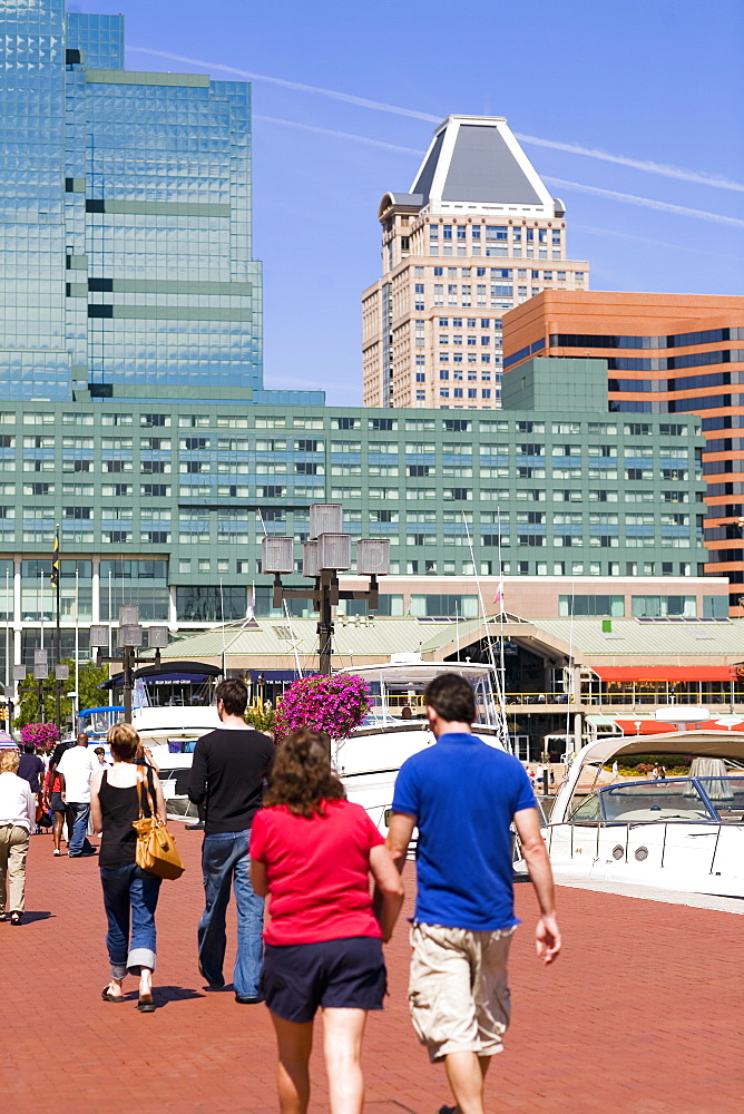 Group of people walking on a pedestrian walkway, Inner Harbor, Baltimore, Maryland, USA