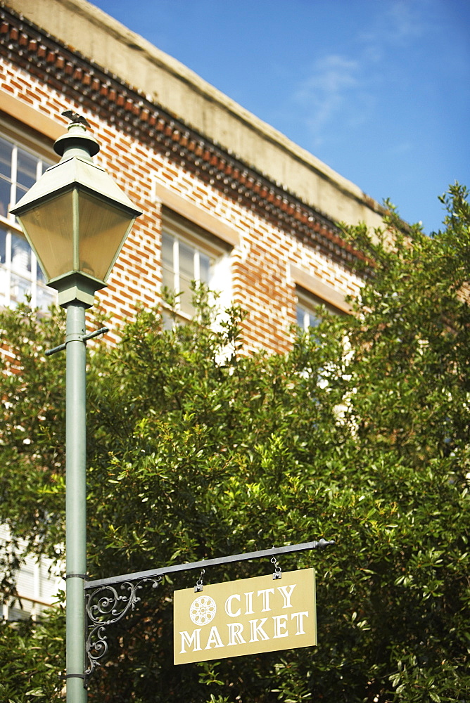 Low angle view of an information board hanging on a lamppost, Savannah, Georgia, USA