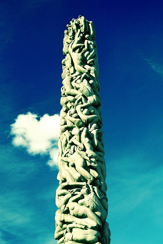 Low angle view of sculptures carved on a column, Gustav Vigeland Sculpture Park, Oslo, Norway