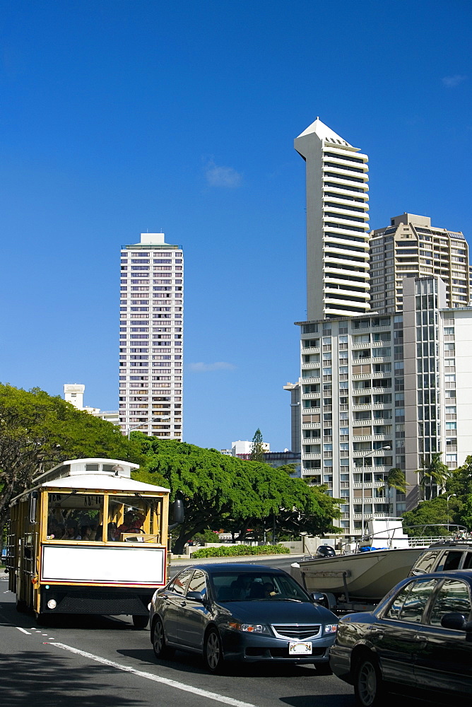Traffic on the road with skyscrapers in the background, Honolulu, Oahu, Hawaii Islands, USA